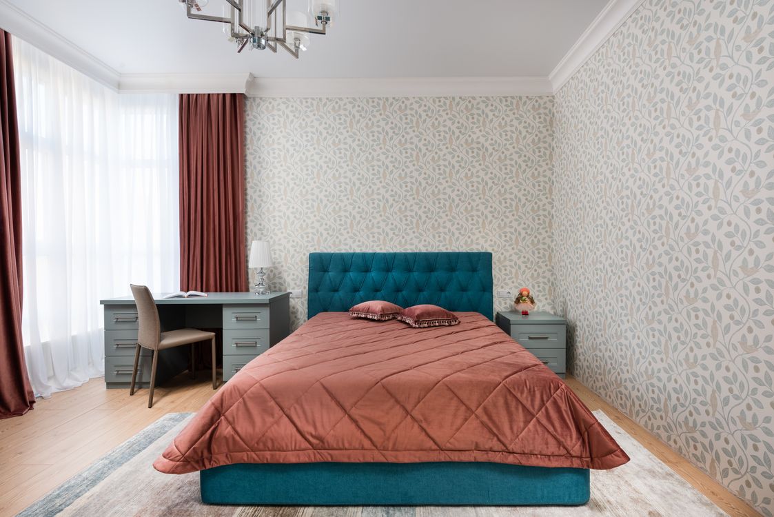 Botanical print wallpaper in a bright bedroom