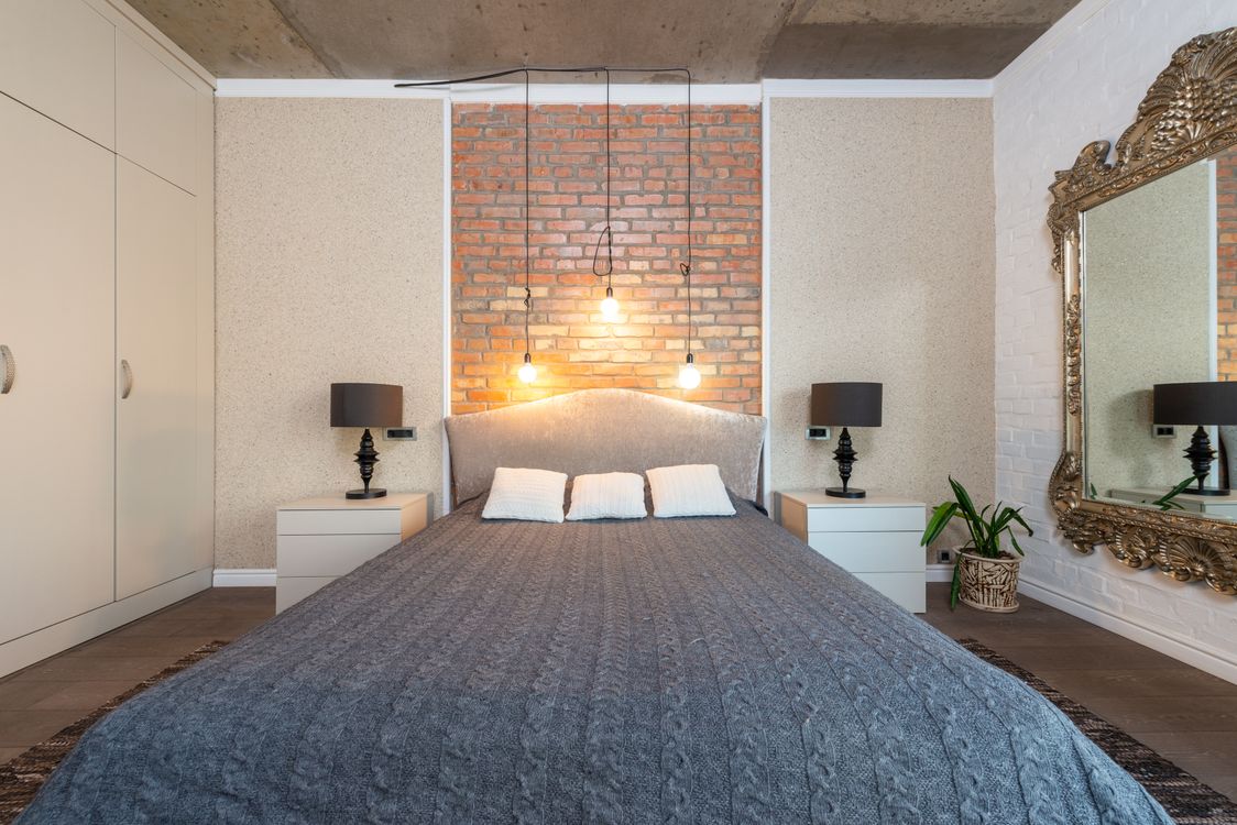 Faux brick texture accent wall in a bedroom