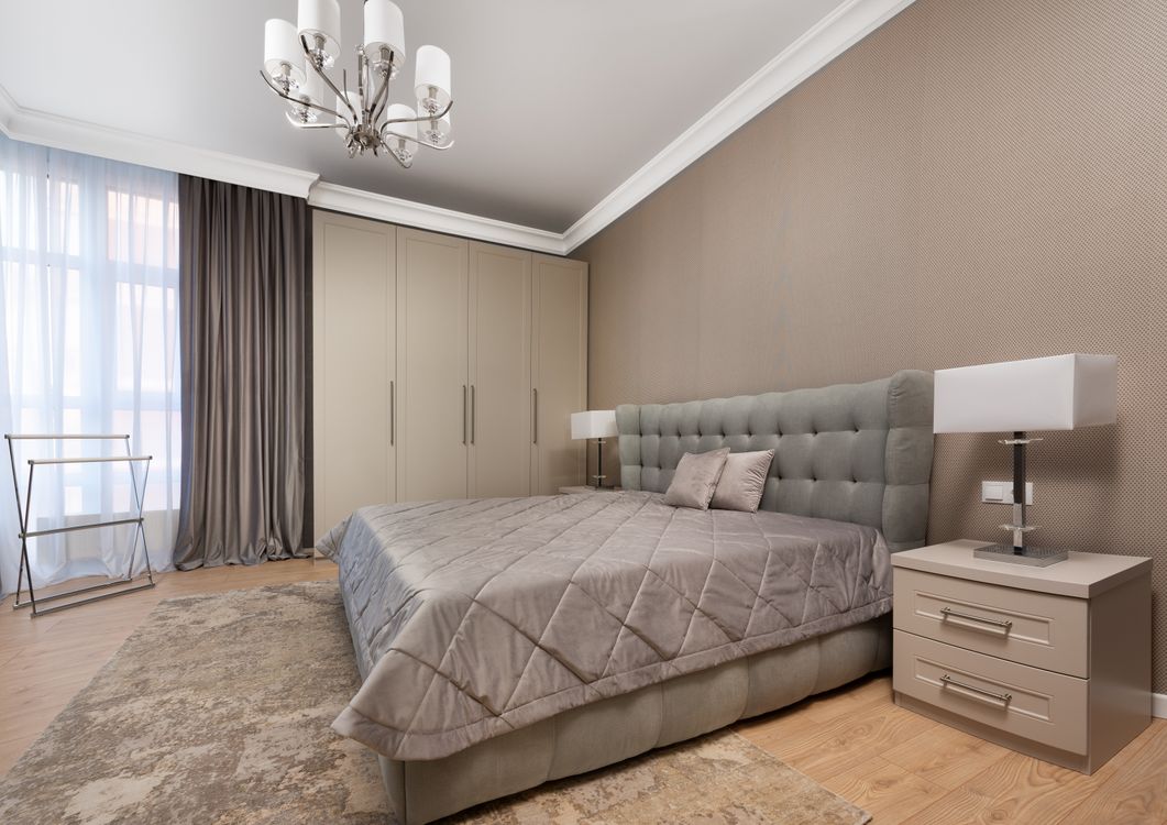 Neutral textured wallpaper in a calm bedroom